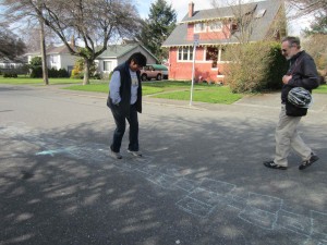 Victoria City Councillor Charlayne Thornton-Joe tries out hopscotch on Carroll St.